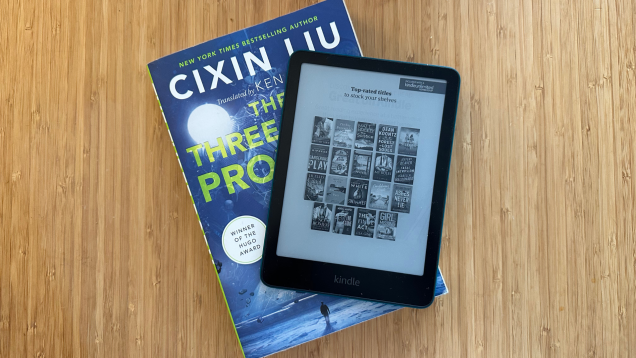 A Kindle Paperwhite on top of a book